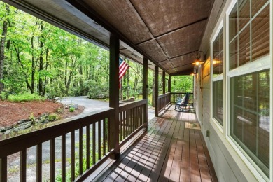 Located in Sapphire Valley, this 3-bedroom, 2.5-bathroom cabin on Sapphire National Golf Club in North Carolina - for sale on GolfHomes.com, golf home, golf lot
