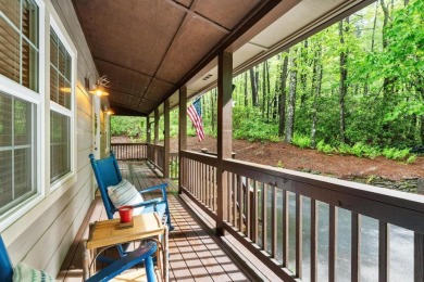 Located in Sapphire Valley, this 3-bedroom, 2.5-bathroom cabin on Sapphire National Golf Club in North Carolina - for sale on GolfHomes.com, golf home, golf lot