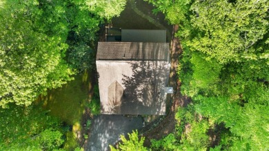 Located in Sapphire Valley, this 3-bedroom, 2.5-bathroom cabin on Sapphire National Golf Club in North Carolina - for sale on GolfHomes.com, golf home, golf lot