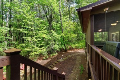 Located in Sapphire Valley, this 3-bedroom, 2.5-bathroom cabin on Sapphire National Golf Club in North Carolina - for sale on GolfHomes.com, golf home, golf lot