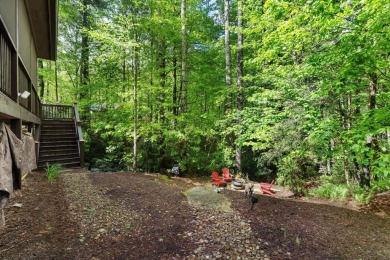 Located in Sapphire Valley, this 3-bedroom, 2.5-bathroom cabin on Sapphire National Golf Club in North Carolina - for sale on GolfHomes.com, golf home, golf lot