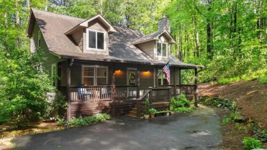 Located in Sapphire Valley, this 3-bedroom, 2.5-bathroom cabin on Sapphire National Golf Club in North Carolina - for sale on GolfHomes.com, golf home, golf lot