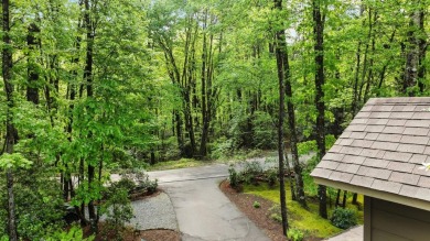 Located in Sapphire Valley, this 3-bedroom, 2.5-bathroom cabin on Sapphire National Golf Club in North Carolina - for sale on GolfHomes.com, golf home, golf lot
