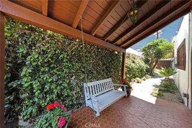 Welcome to 440 W San Antonio Drive, a timeless Spanish-style gem on Virginia Country Club in California - for sale on GolfHomes.com, golf home, golf lot