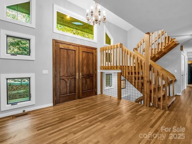 Beautiful resort home on 2.4 private wooded acres within minutes on Rumbling Bald Resort on Lake Lure in North Carolina - for sale on GolfHomes.com, golf home, golf lot