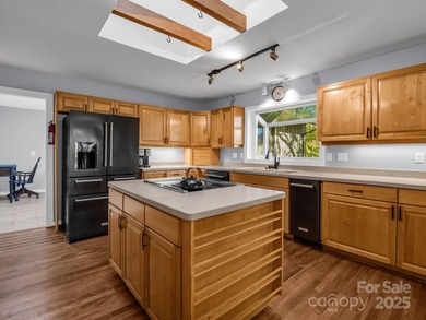 Beautiful resort home on 2.4 private wooded acres within minutes on Rumbling Bald Resort on Lake Lure in North Carolina - for sale on GolfHomes.com, golf home, golf lot