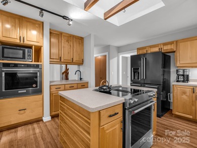 Beautiful resort home on 2.4 private wooded acres within minutes on Rumbling Bald Resort on Lake Lure in North Carolina - for sale on GolfHomes.com, golf home, golf lot