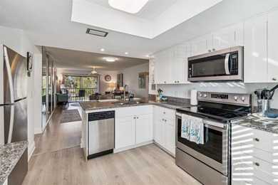 Located in East Lake Woodlands this quiet private second-story on East Lake Woodlands Country Club in Florida - for sale on GolfHomes.com, golf home, golf lot