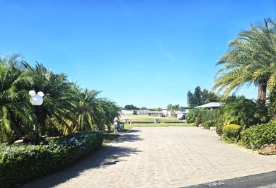 Located on the 15th fairway of the executive golf course at Deer on Deer Creek RV Golf Resort in Florida - for sale on GolfHomes.com, golf home, golf lot