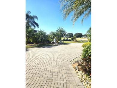Located on the 15th fairway of the executive golf course at Deer on Deer Creek RV Golf Resort in Florida - for sale on GolfHomes.com, golf home, golf lot