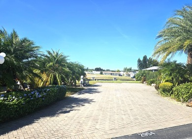 Located on the 15th fairway of the executive golf course at Deer on Deer Creek RV Golf Resort in Florida - for sale on GolfHomes.com, golf home, golf lot