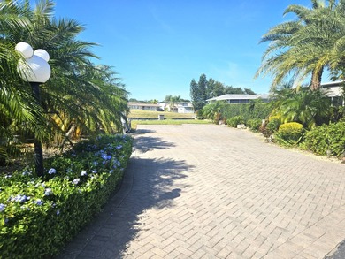 Located on the 15th fairway of the executive golf course at Deer on Deer Creek RV Golf Resort in Florida - for sale on GolfHomes.com, golf home, golf lot