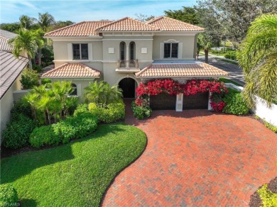 This magnificent two-story courtyard style home features 4BR, 4 on Pelican Marsh Golf Club in Florida - for sale on GolfHomes.com, golf home, golf lot