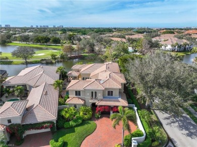 This magnificent two-story courtyard style home features 4BR, 4 on Pelican Marsh Golf Club in Florida - for sale on GolfHomes.com, golf home, golf lot