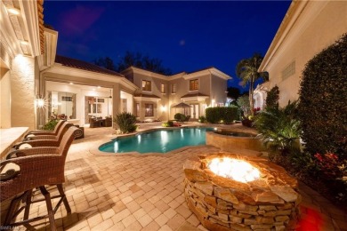 This magnificent two-story courtyard style home features 4BR, 4 on Pelican Marsh Golf Club in Florida - for sale on GolfHomes.com, golf home, golf lot