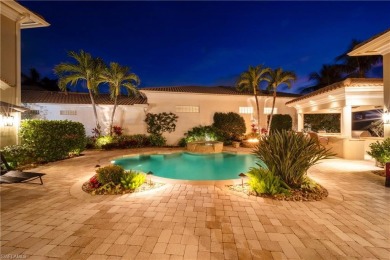 This magnificent two-story courtyard style home features 4BR, 4 on Pelican Marsh Golf Club in Florida - for sale on GolfHomes.com, golf home, golf lot