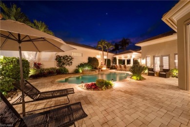 This magnificent two-story courtyard style home features 4BR, 4 on Pelican Marsh Golf Club in Florida - for sale on GolfHomes.com, golf home, golf lot