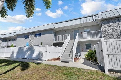 Welcome to easy Florida living at this perfectly located 1/1 on Cypress Lake Country Club in Florida - for sale on GolfHomes.com, golf home, golf lot