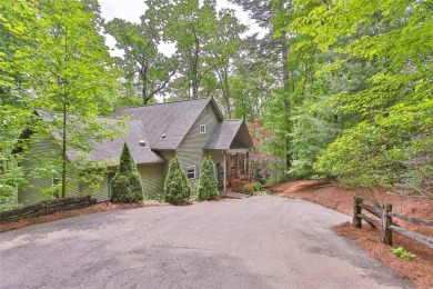 Immersed in tranquility, this three-bedroom, three-bathroom on Sapphire National Golf Club in North Carolina - for sale on GolfHomes.com, golf home, golf lot