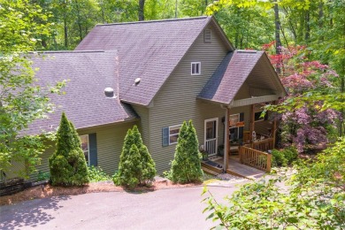 Immersed in tranquility, this three-bedroom, three-bathroom on Sapphire National Golf Club in North Carolina - for sale on GolfHomes.com, golf home, golf lot