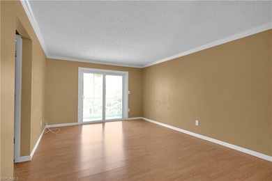 Welcome to easy Florida living at this perfectly located 1/1 on Cypress Lake Country Club in Florida - for sale on GolfHomes.com, golf home, golf lot