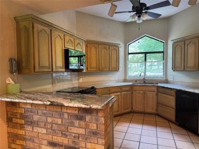 Great curb appeal on this 3BD-3BA Golf Course Home at Holly Lake on Holly Lake Ranch Golf Club in Texas - for sale on GolfHomes.com, golf home, golf lot