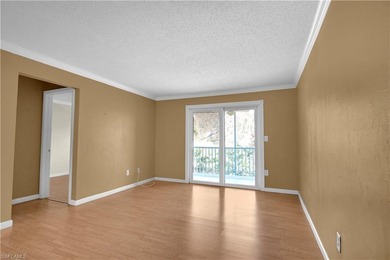 Welcome to easy Florida living at this perfectly located 1/1 on Cypress Lake Country Club in Florida - for sale on GolfHomes.com, golf home, golf lot