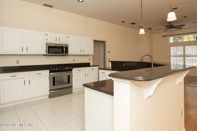 Beautifully maintained one story, 3 bedroom,2 bathroom home on Jacksonville Golf and Country Club in Florida - for sale on GolfHomes.com, golf home, golf lot