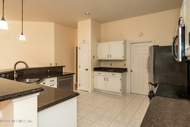 Beautifully maintained one story, 3 bedroom,2 bathroom home on Jacksonville Golf and Country Club in Florida - for sale on GolfHomes.com, golf home, golf lot