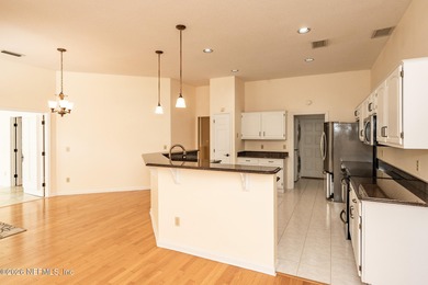 Beautifully maintained one story, 3 bedroom,2 bathroom home on Jacksonville Golf and Country Club in Florida - for sale on GolfHomes.com, golf home, golf lot