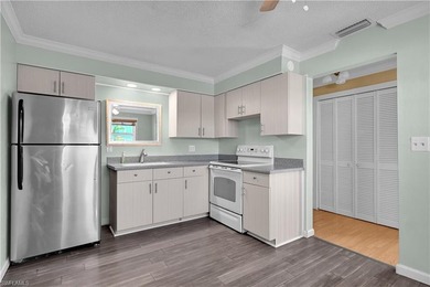 Welcome to easy Florida living at this perfectly located 1/1 on Cypress Lake Country Club in Florida - for sale on GolfHomes.com, golf home, golf lot