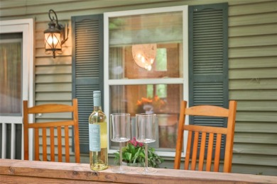 Immersed in tranquility, this three-bedroom, three-bathroom on Sapphire National Golf Club in North Carolina - for sale on GolfHomes.com, golf home, golf lot
