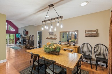 Immersed in tranquility, this three-bedroom, three-bathroom on Sapphire National Golf Club in North Carolina - for sale on GolfHomes.com, golf home, golf lot
