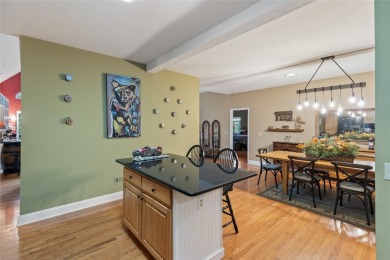 Immersed in tranquility, this three-bedroom, three-bathroom on Sapphire National Golf Club in North Carolina - for sale on GolfHomes.com, golf home, golf lot
