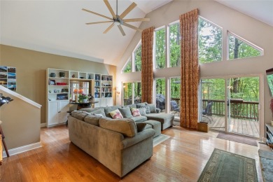 Immersed in tranquility, this three-bedroom, three-bathroom on Sapphire National Golf Club in North Carolina - for sale on GolfHomes.com, golf home, golf lot