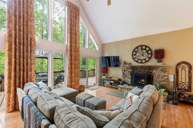 Immersed in tranquility, this three-bedroom, three-bathroom on Sapphire National Golf Club in North Carolina - for sale on GolfHomes.com, golf home, golf lot