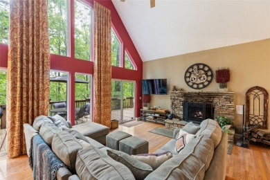 Immersed in tranquility, this three-bedroom, three-bathroom on Sapphire National Golf Club in North Carolina - for sale on GolfHomes.com, golf home, golf lot