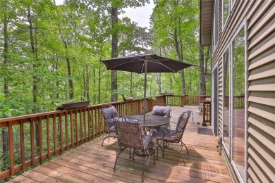 Immersed in tranquility, this three-bedroom, three-bathroom on Sapphire National Golf Club in North Carolina - for sale on GolfHomes.com, golf home, golf lot