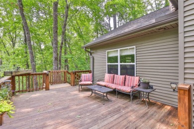 Immersed in tranquility, this three-bedroom, three-bathroom on Sapphire National Golf Club in North Carolina - for sale on GolfHomes.com, golf home, golf lot