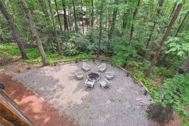 Immersed in tranquility, this three-bedroom, three-bathroom on Sapphire National Golf Club in North Carolina - for sale on GolfHomes.com, golf home, golf lot
