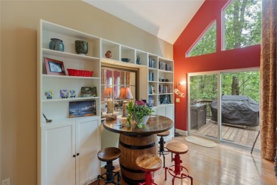 Immersed in tranquility, this three-bedroom, three-bathroom on Sapphire National Golf Club in North Carolina - for sale on GolfHomes.com, golf home, golf lot