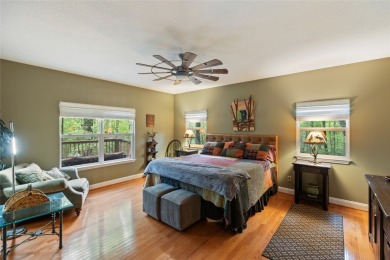 Immersed in tranquility, this three-bedroom, three-bathroom on Sapphire National Golf Club in North Carolina - for sale on GolfHomes.com, golf home, golf lot