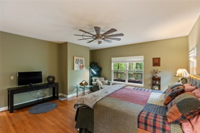 Immersed in tranquility, this three-bedroom, three-bathroom on Sapphire National Golf Club in North Carolina - for sale on GolfHomes.com, golf home, golf lot