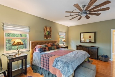Immersed in tranquility, this three-bedroom, three-bathroom on Sapphire National Golf Club in North Carolina - for sale on GolfHomes.com, golf home, golf lot