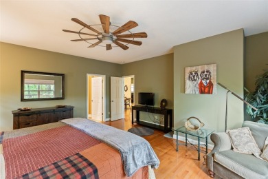 Immersed in tranquility, this three-bedroom, three-bathroom on Sapphire National Golf Club in North Carolina - for sale on GolfHomes.com, golf home, golf lot