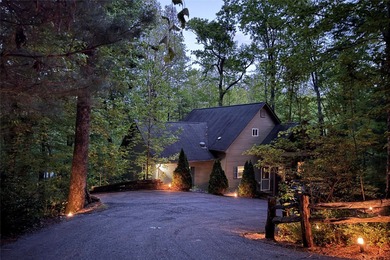 Immersed in tranquility, this three-bedroom mountain home on Sapphire National Golf Club in North Carolina - for sale on GolfHomes.com, golf home, golf lot