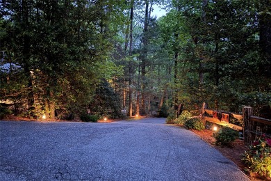 Immersed in tranquility, this three-bedroom mountain home on Sapphire National Golf Club in North Carolina - for sale on GolfHomes.com, golf home, golf lot