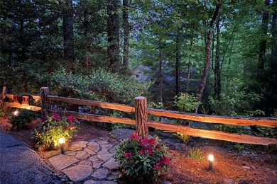Immersed in tranquility, this three-bedroom mountain home on Sapphire National Golf Club in North Carolina - for sale on GolfHomes.com, golf home, golf lot