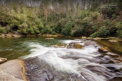 Immersed in tranquility, this three-bedroom mountain home on Sapphire National Golf Club in North Carolina - for sale on GolfHomes.com, golf home, golf lot