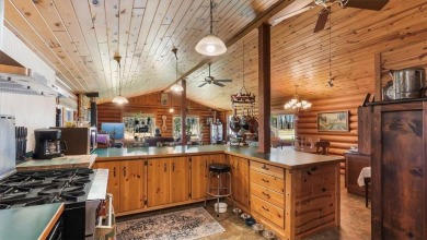 Charming Log Home (with 4 adjoining parcels for over 1 acre of on Hardwoods Golf Club At Mille Lacs in Minnesota - for sale on GolfHomes.com, golf home, golf lot